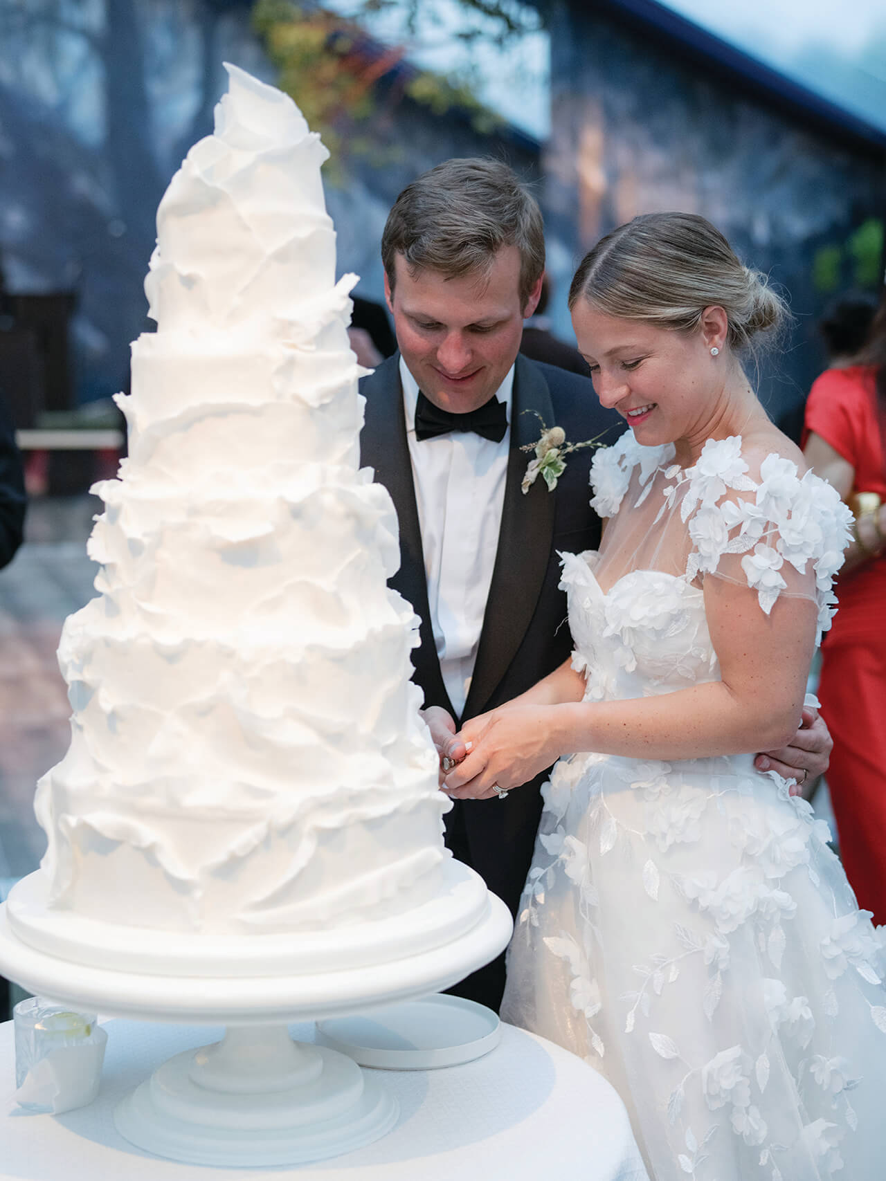 bride and groom cutting their five-tier wedding cake