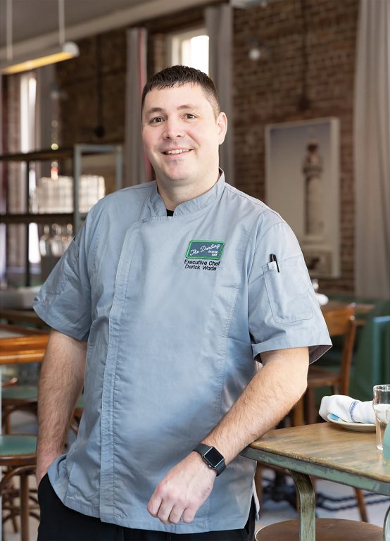 Chef standing in a dining room