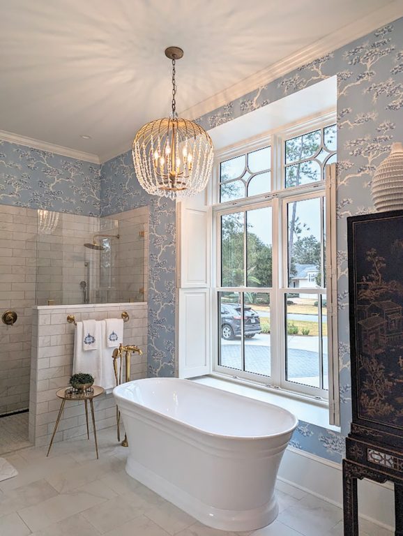 A bathroom with a soaking tub and tile shower