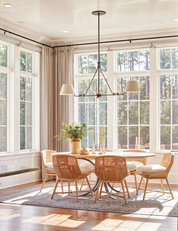 A dining room with a table and chairs