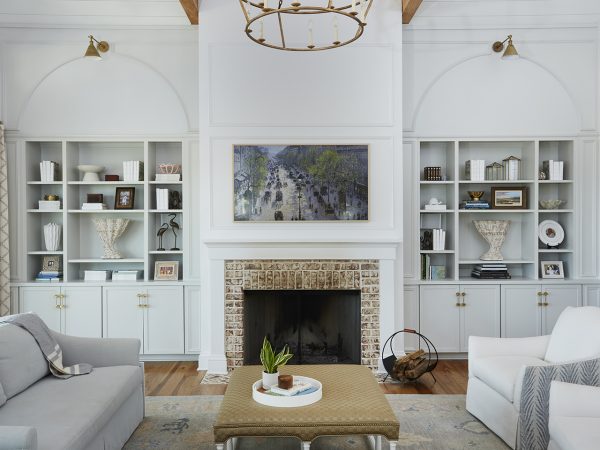 Living room with fireplace flanked by built-in bookshelves