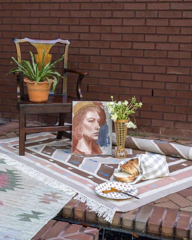 Antique chair sitting on outdoor rugs