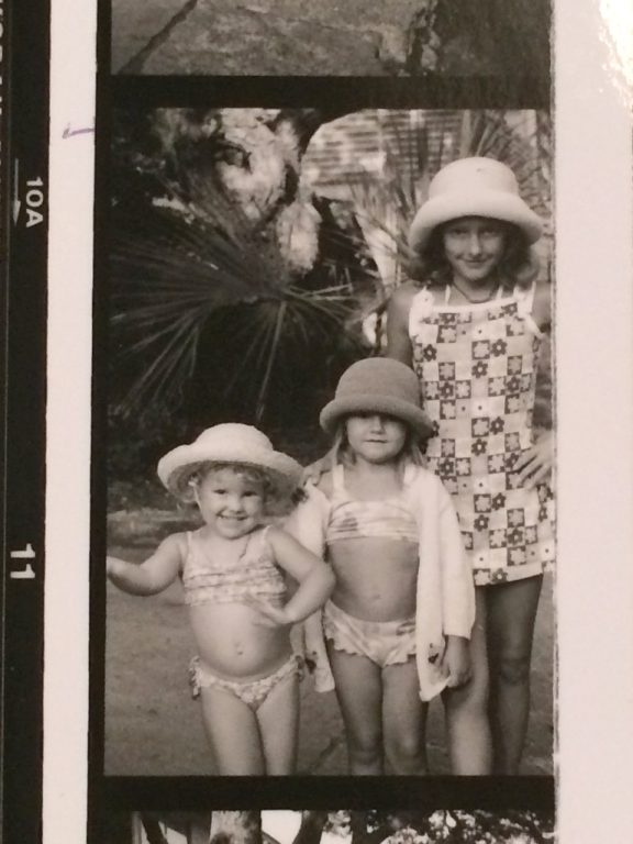 black and white photo of three little girls in bathing suits