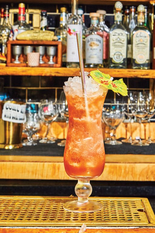 A fancy tropical cocktail with an umbrella