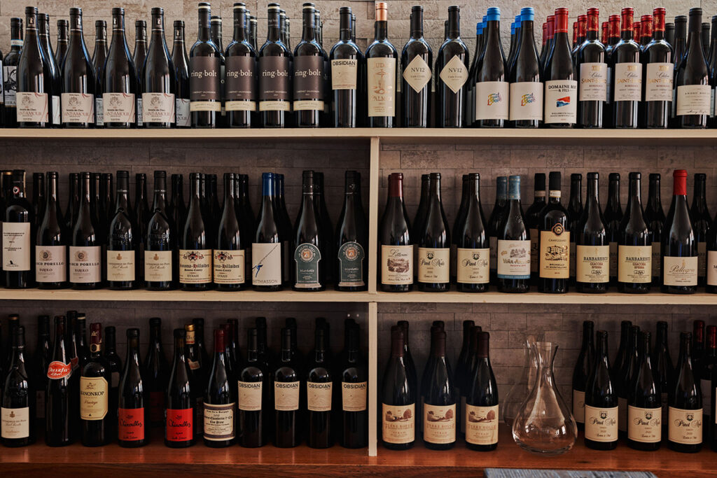 Shelves lined with bottles of wine