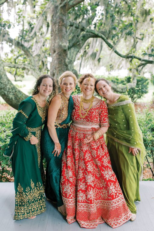 A bride and bridesmaids dressed in traditional wedding attire