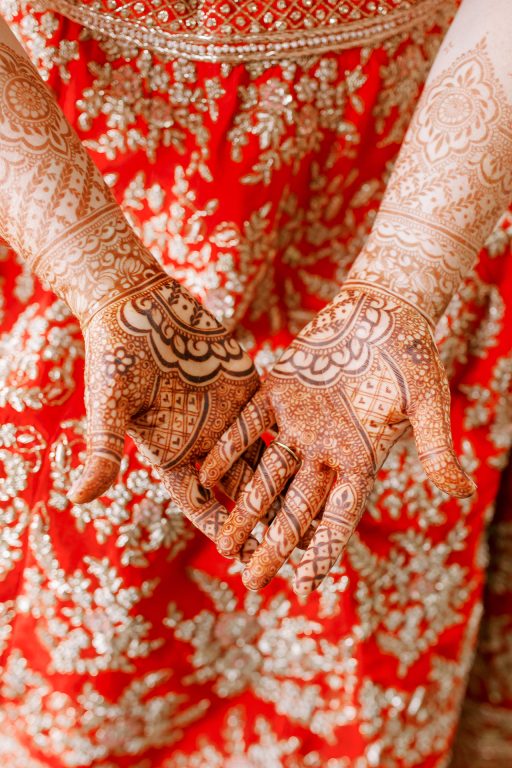 A woman's hands and forearms decorated with henna