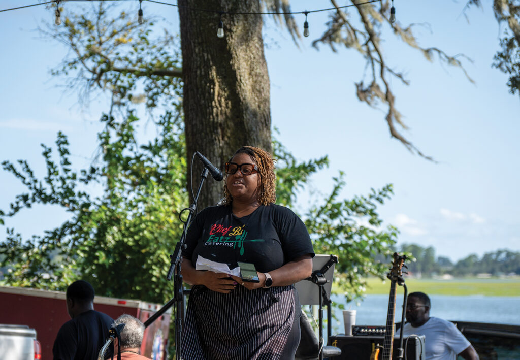 a black woman speaking into a microphone