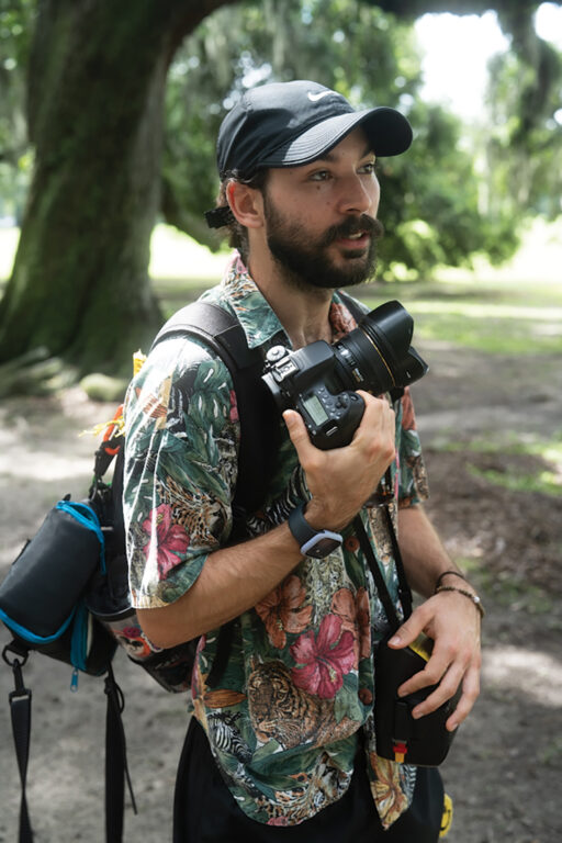 A man holding photography gear