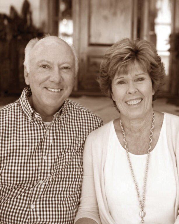 A black-and-white photo of a middle-age couple