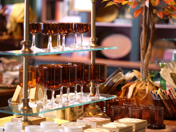 handcrafted brown wine glasses displayed in a gift shop