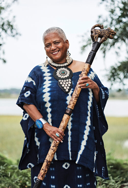 Gulla Geechee Storyteller Lillian Grant Baptiste holds a staff