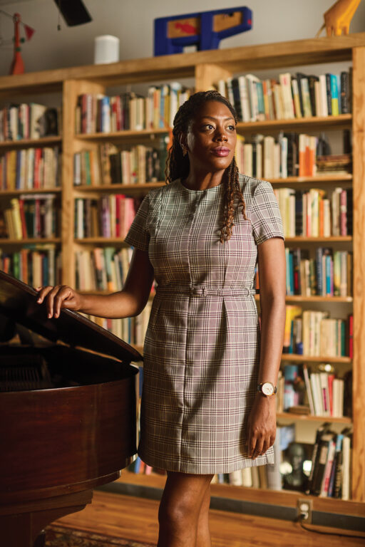 Chassidy Malloy standing in front of a bookshelf