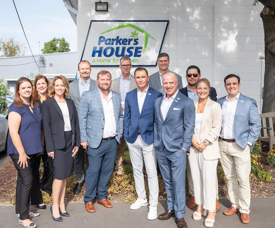 Giving Back: Savannah businessman and others in front of Parker's House: A Home for Women