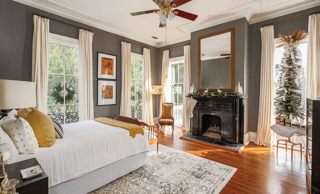 A Victorian bedroom adorned with holiday decor