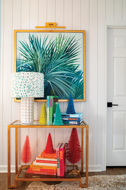 An entryway decorated with colorful bottlebrush Christmas trees