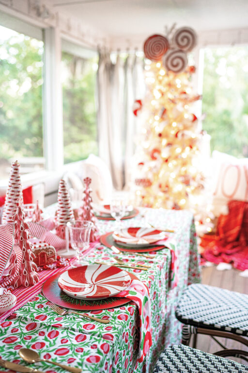 A table set with candy cane-themed decor