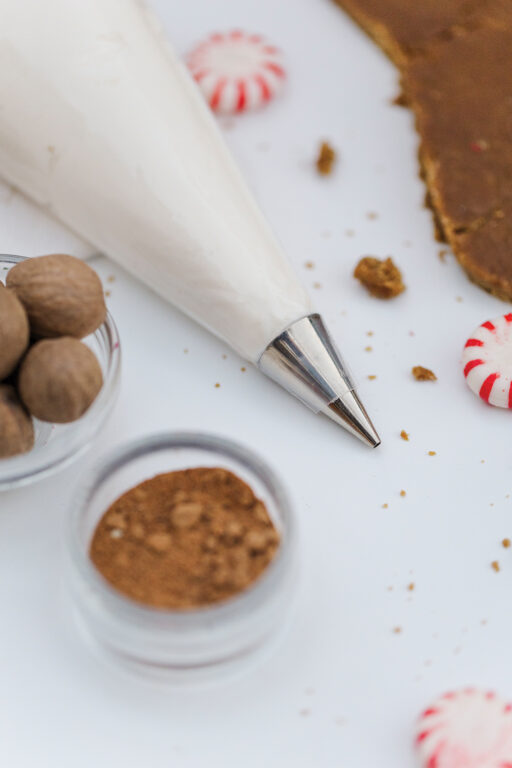 Gingerbread cookie supplies on a white stone countertop