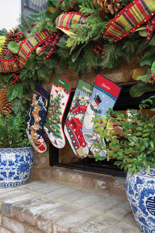 Four stockings hanging from the fireplace