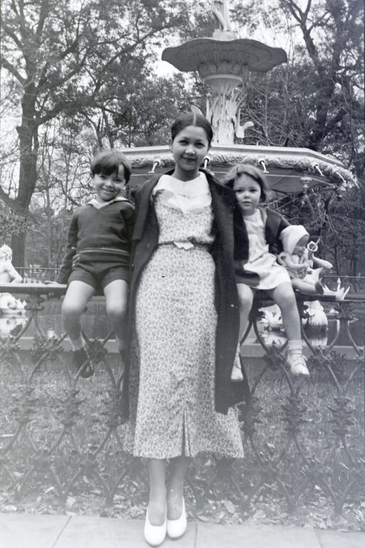 A woman with her children in front of the Forsyth Park fountain in Savannah Georgia