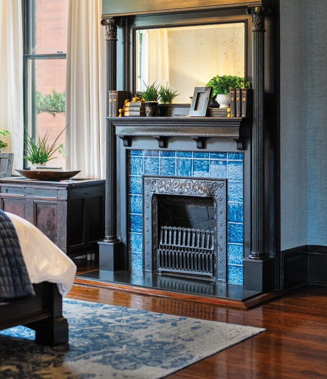 Carved dark wood fireplace mantel with blue tile