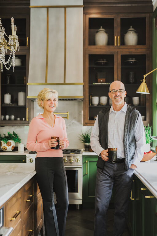 A couple stands in their newly remodeled kitchen