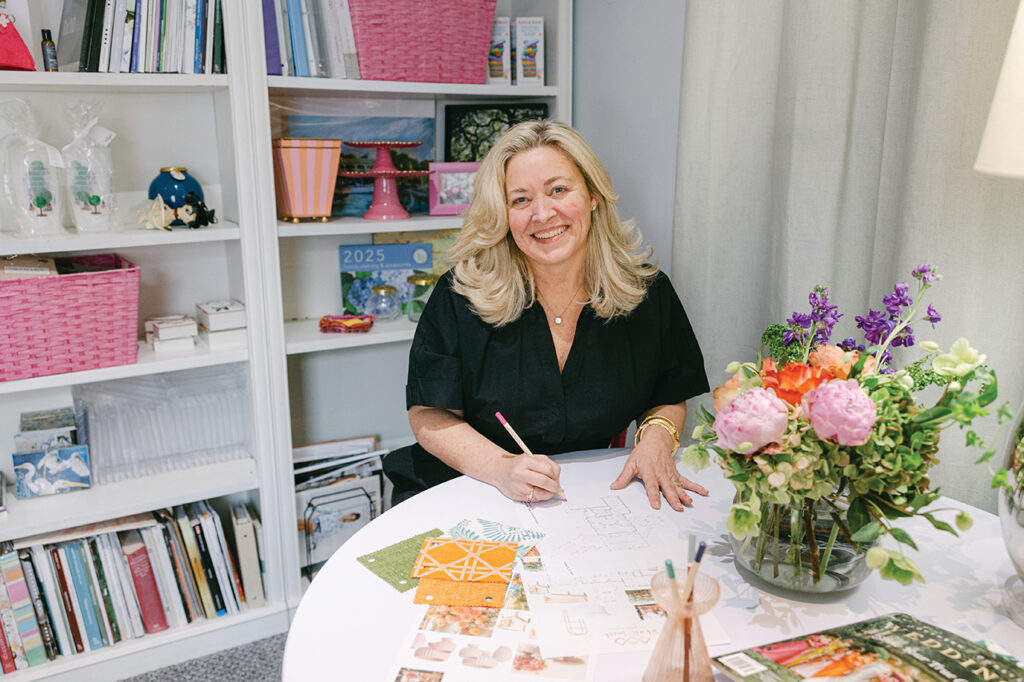 Woman smiling and working at a desk
