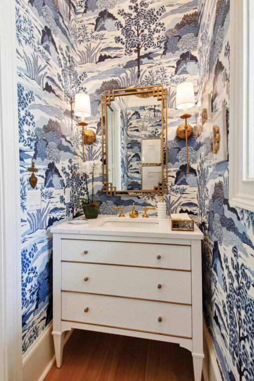 Powder room with blue and white wallpaper