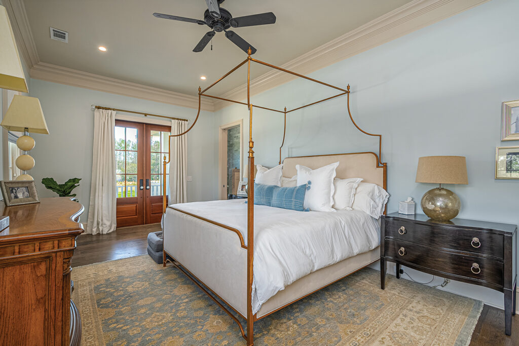A master suit with four-post bed