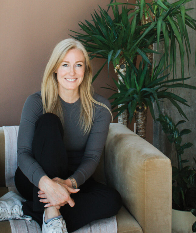 Blonde woman sitting on a couch