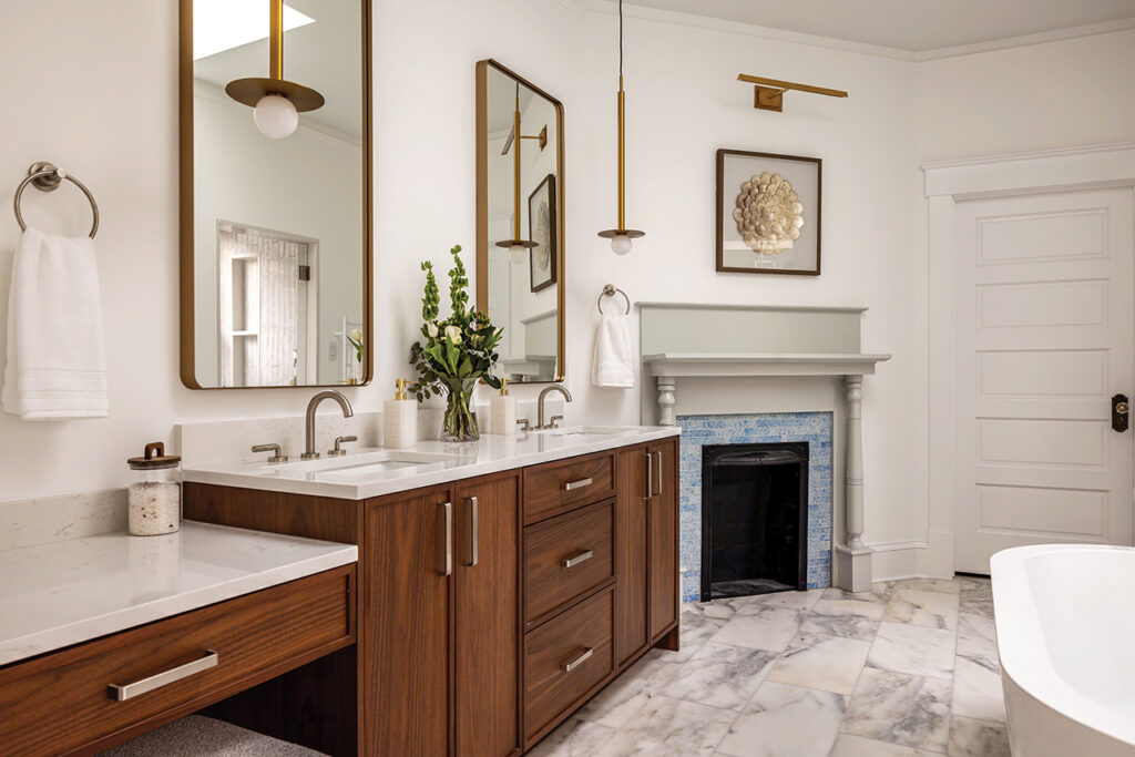 A primary bathroom with soaking tub and fireplace