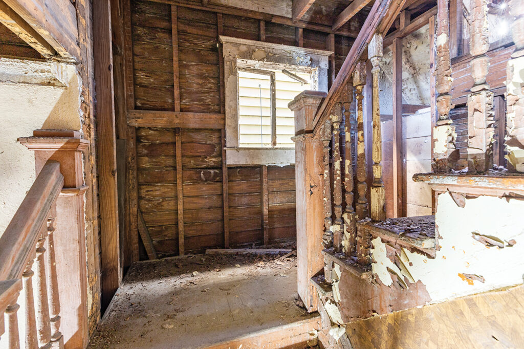 Crumbling staircase inside a run down home