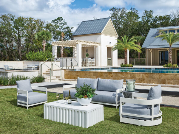 Back yard with pool, bar and numerous seating areas with outdoor furniture