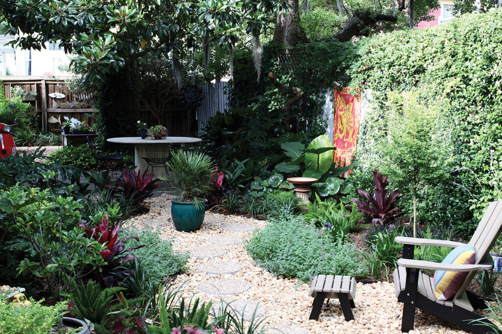 Garden area with lush vegetation and a stone walkway