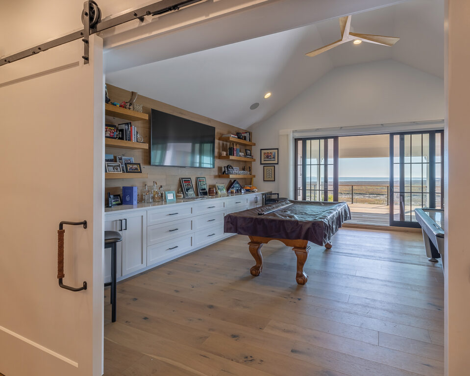 Billiard room with sliding barn door