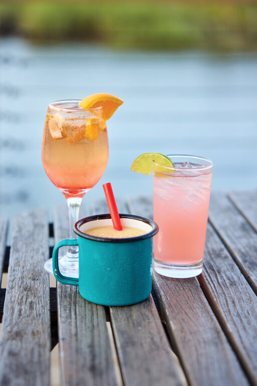 Three cocktails on a wooden table