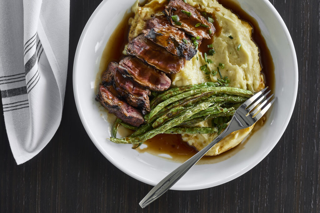 plate of steak, mashed potatoes and green beans