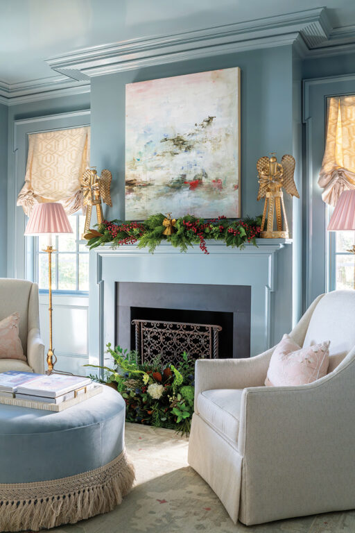 A parlor room with grey-blue walls and ceiling and a fireplace