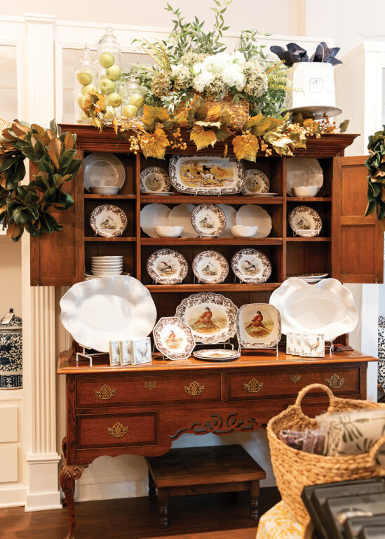 Wood hutch with hand-painted dishes displayed