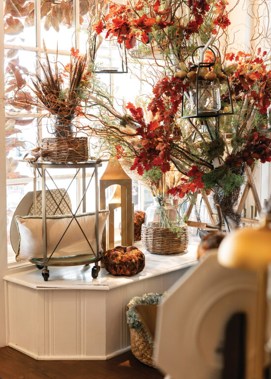 A window display of fall home decor