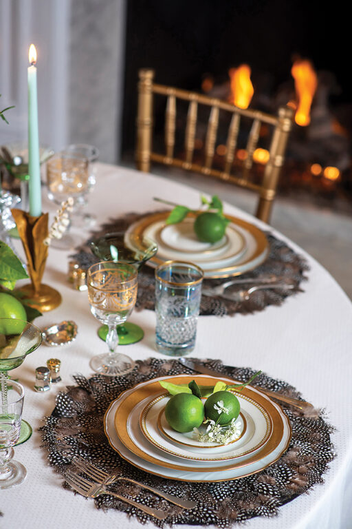 Place settings made of pheasant feathers and gold rimmed plates