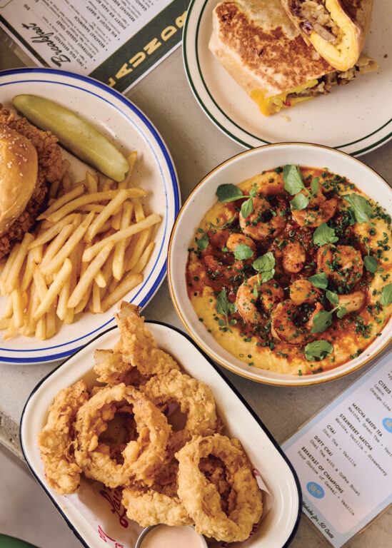 Onion rings, fries, shrimp and grits, and a fried chicken sandwich