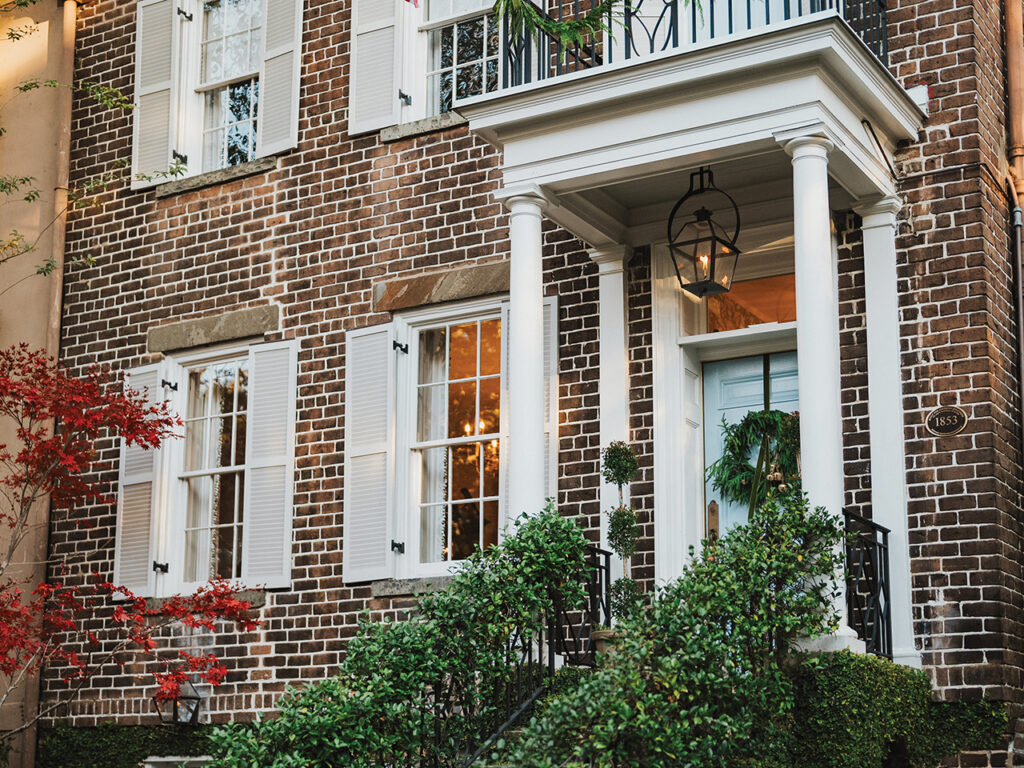 The light blue front door of a historic home