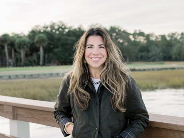 Kati Ann Wright stands on a boat dock