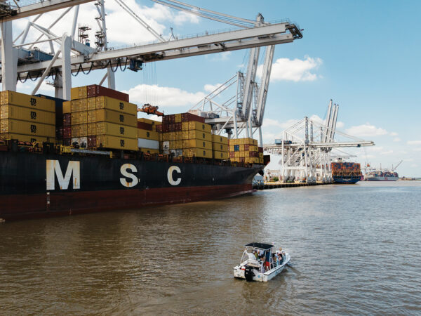 A cargo ship stacked with containers