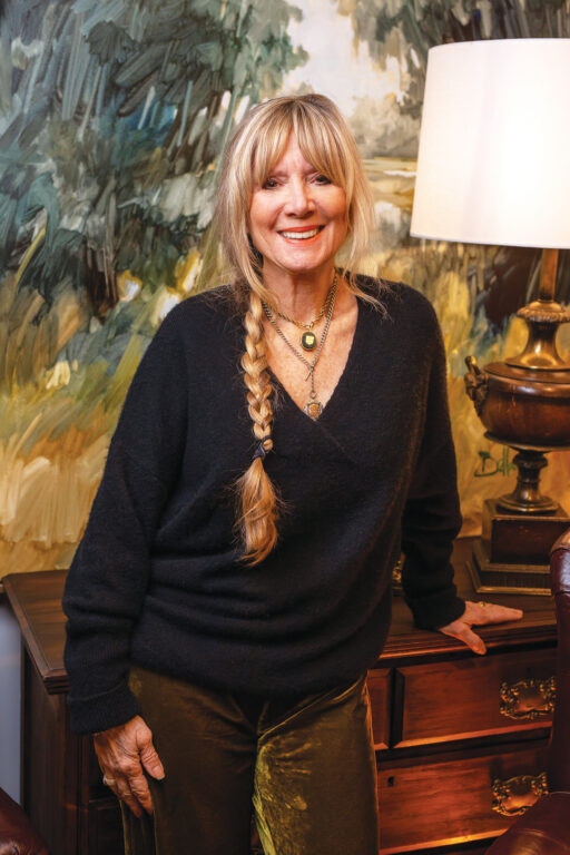 Bellamy Murphy stands in front of one of her paintings at NoFo