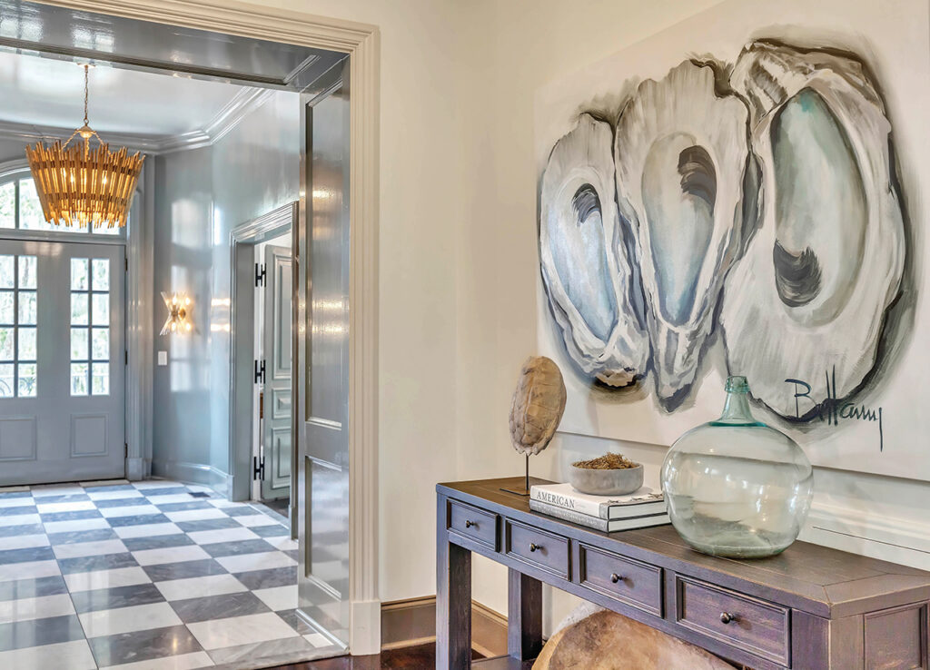 A Bellamy Murphy painting of oysters hangs in the home's vestibule
