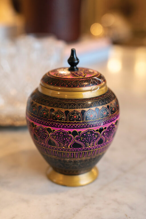 Carved and pointed wooden urn