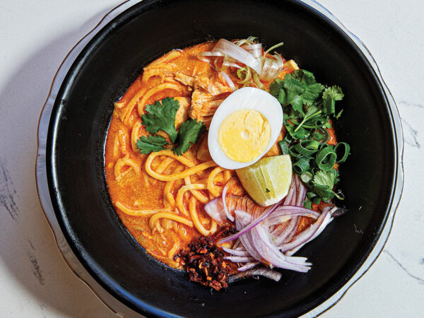 Bowl of noodles with half a boiled egg on top