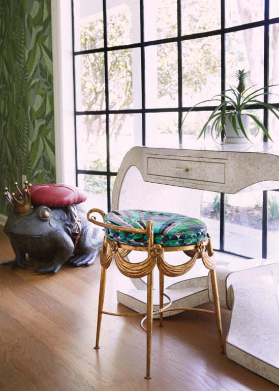 A fantasy chair accompanied by a frog-prince footstool